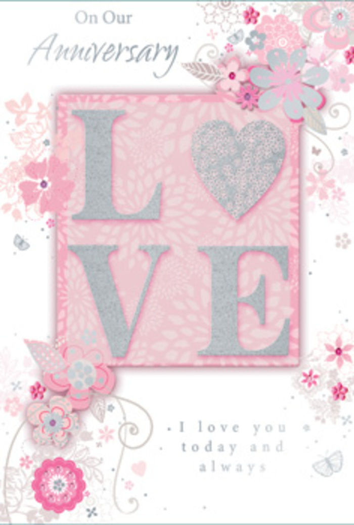 This anniversary card opens like a soft whisper of devotion, the kind of tender keepsake you might pair with an elegant bouquet before visiting a loved one in Biggin Hill. At its heart, the word LOVE stretches across the centre in large, confident letters, each one finished with a frosted, glittery texture. The glitter is fine and even, suggesting a gentle sparkle rather than harsh shine, catching the light the way morning sun catches the edges of fresh petals. Running lightly along the borders and drifting around the central motif are wispy, hand-drawn blooms and sprays of foliage. Their shapes are graceful and slightly abstract, with petals that curve and overlap in shades of blush pink, soft lilac, and creamy ivory. These colours blend harmoniously, reminiscent of pastel arrangements created for anniversary deliveries to homes along Main Road or around the leafy lanes near Biggin Hill Airport. Fine filigree lines weave between the flowers, forming delicate tendrils and dainty leaves that frame the design without crowding it. If you look closer, you can just make out tiny, lightly sketched butterflies, almost hidden among the petals, suggesting the flutter of a happy heart. The background is a gentle pink, softly muted, giving the impression of velvety paper that would feel smooth and substantial in the hand. Nestled beneath or beside the main motif, the message I love you today and always appears in understated type, its simplicity adding to the sincerity of the card. Altogether, the composition feels like a hand-tied bouquet translated into paper form-quiet, romantic, and thoughtfully arranged for an intimate anniversary moment in Biggin Hill.